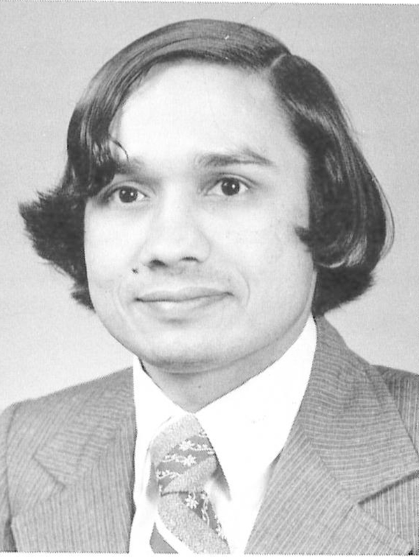 A young professor wearing business attire