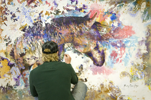 A woman in CAS paints.