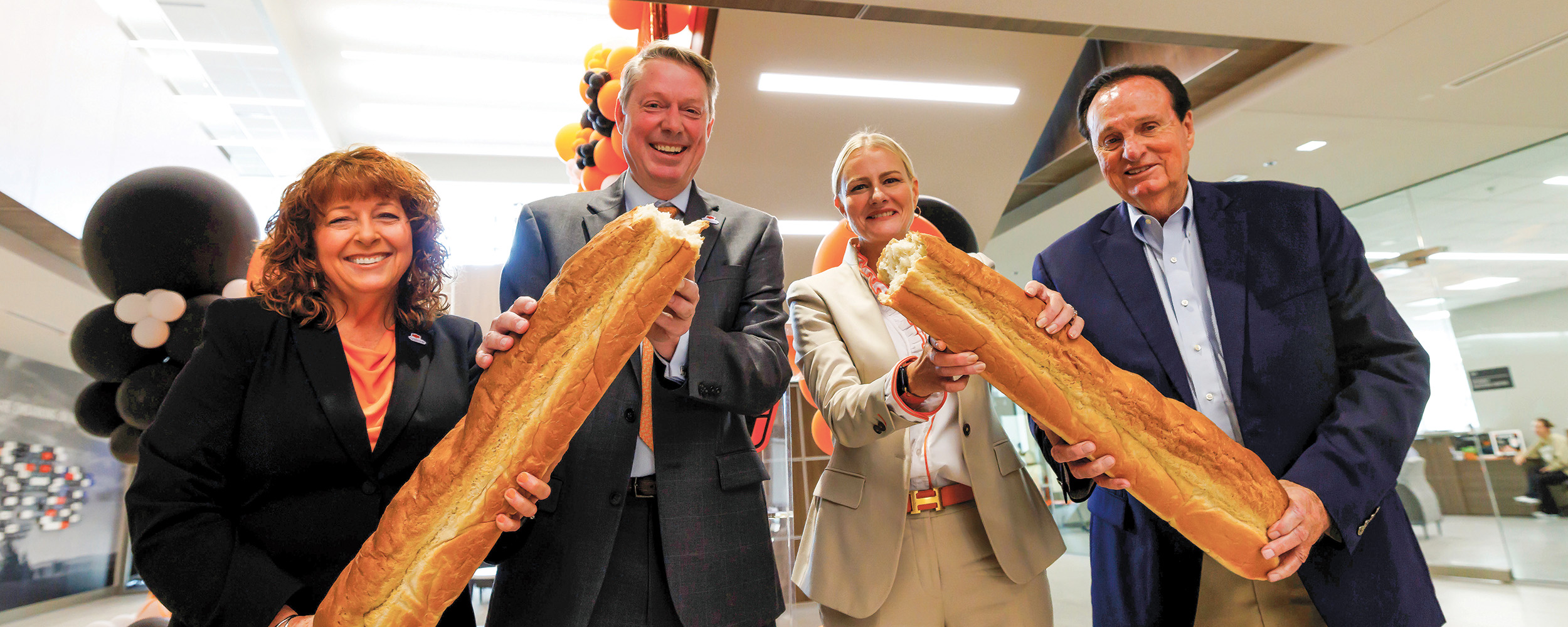 Cynda Clary (left), Jayson Lusk, Kayse Shrum and Jimmy Harrel celebrate the opening of Agricultural Hall. (Photo by Mitchell Alcala)