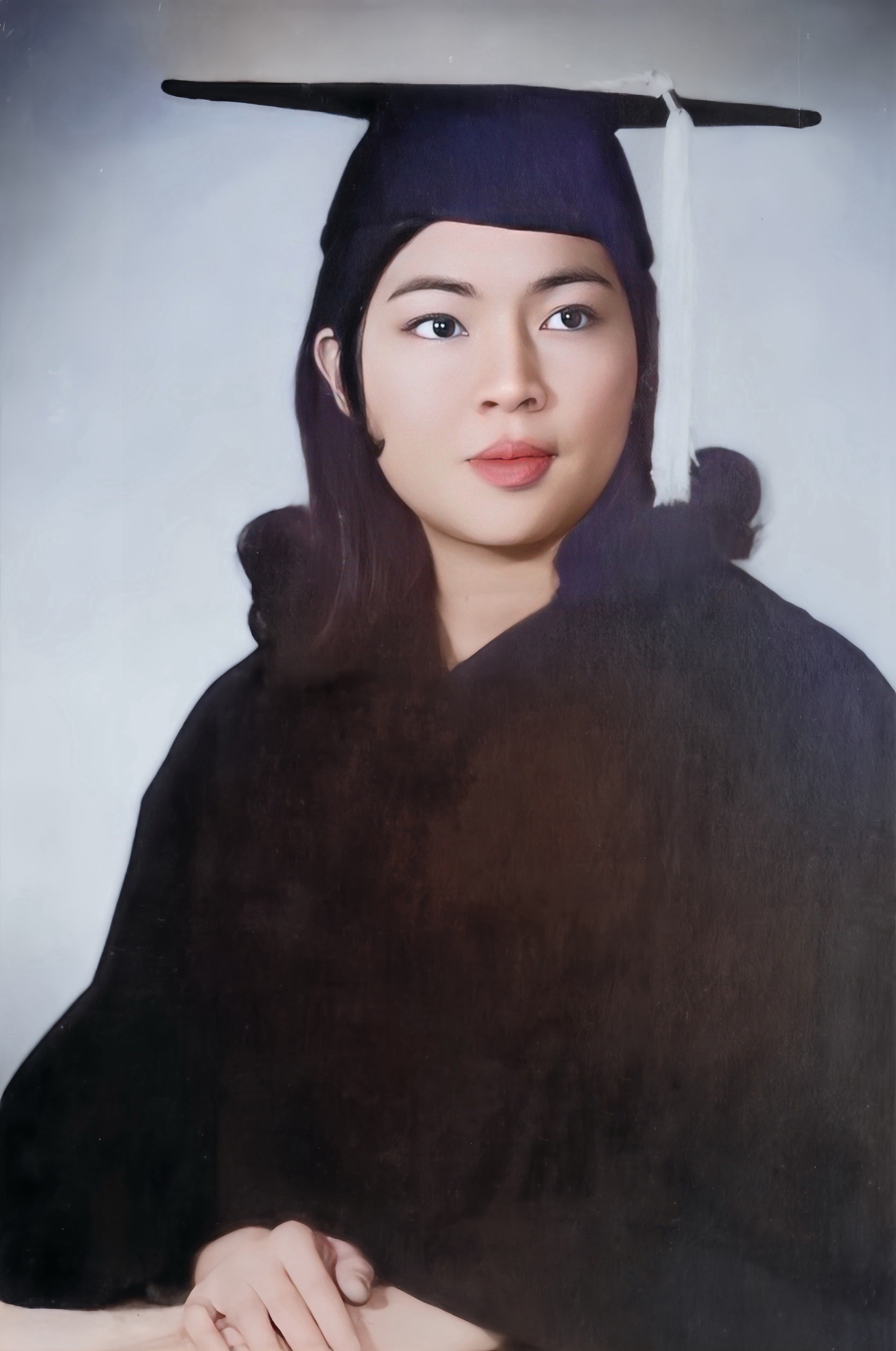 Lakhana Didyasarin poses for OSU graduation portrait.