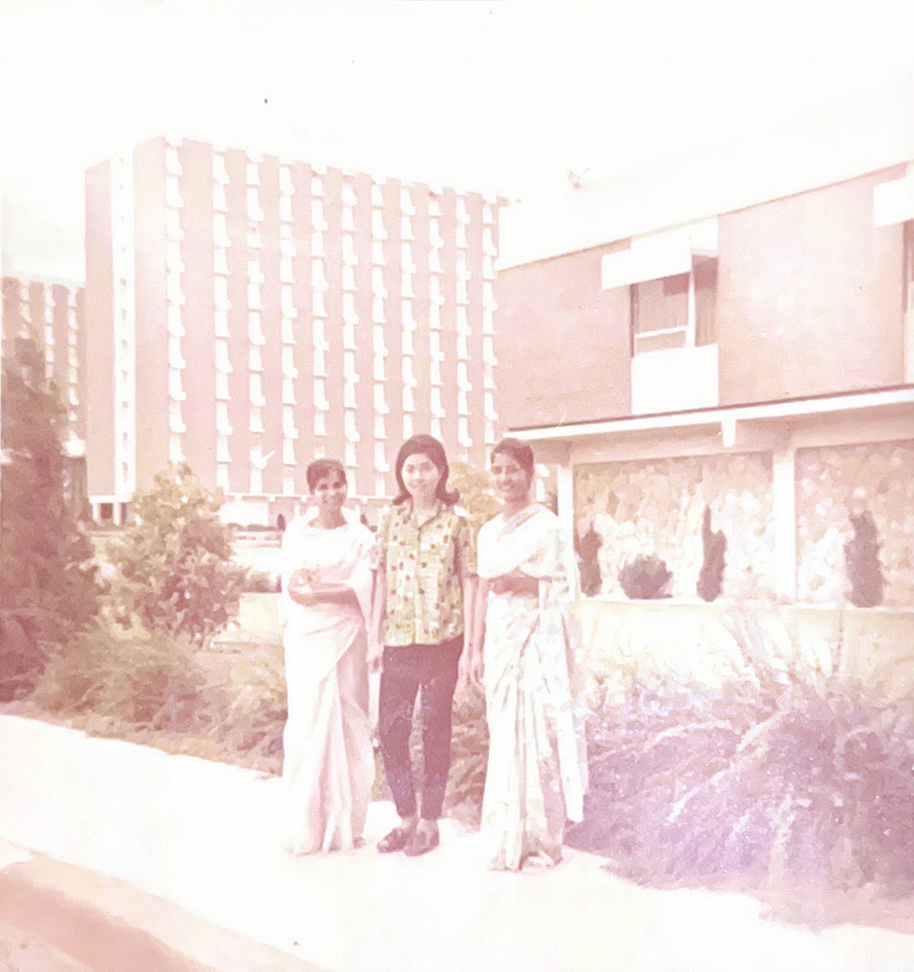 Lakhana poses centered between two classmates on the OSU Stillwater campus. Lakhana poses centered between two classmates on the OSU Stillwater campus.