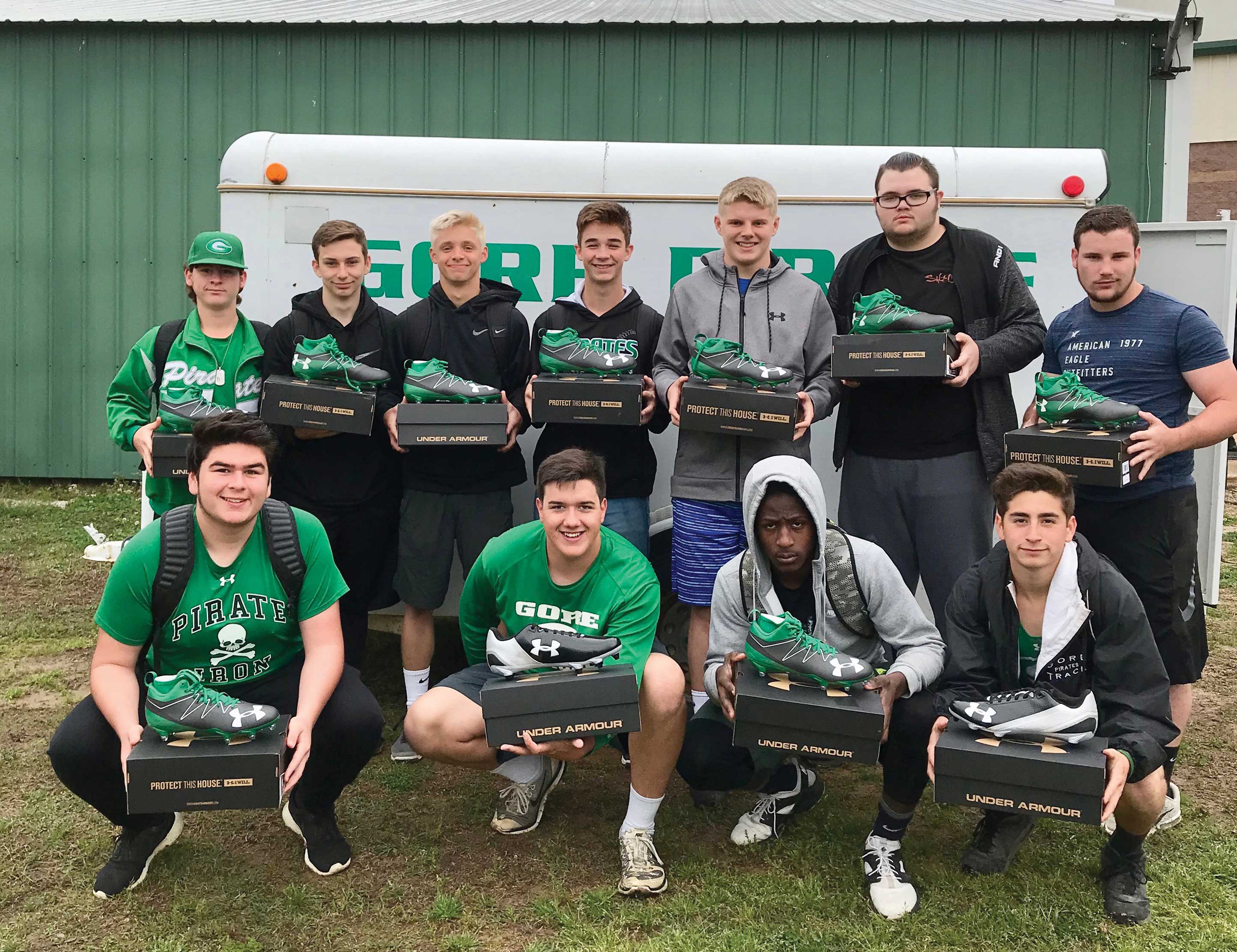 Students from Gore High School in Oklahoma pose with their new cleats.