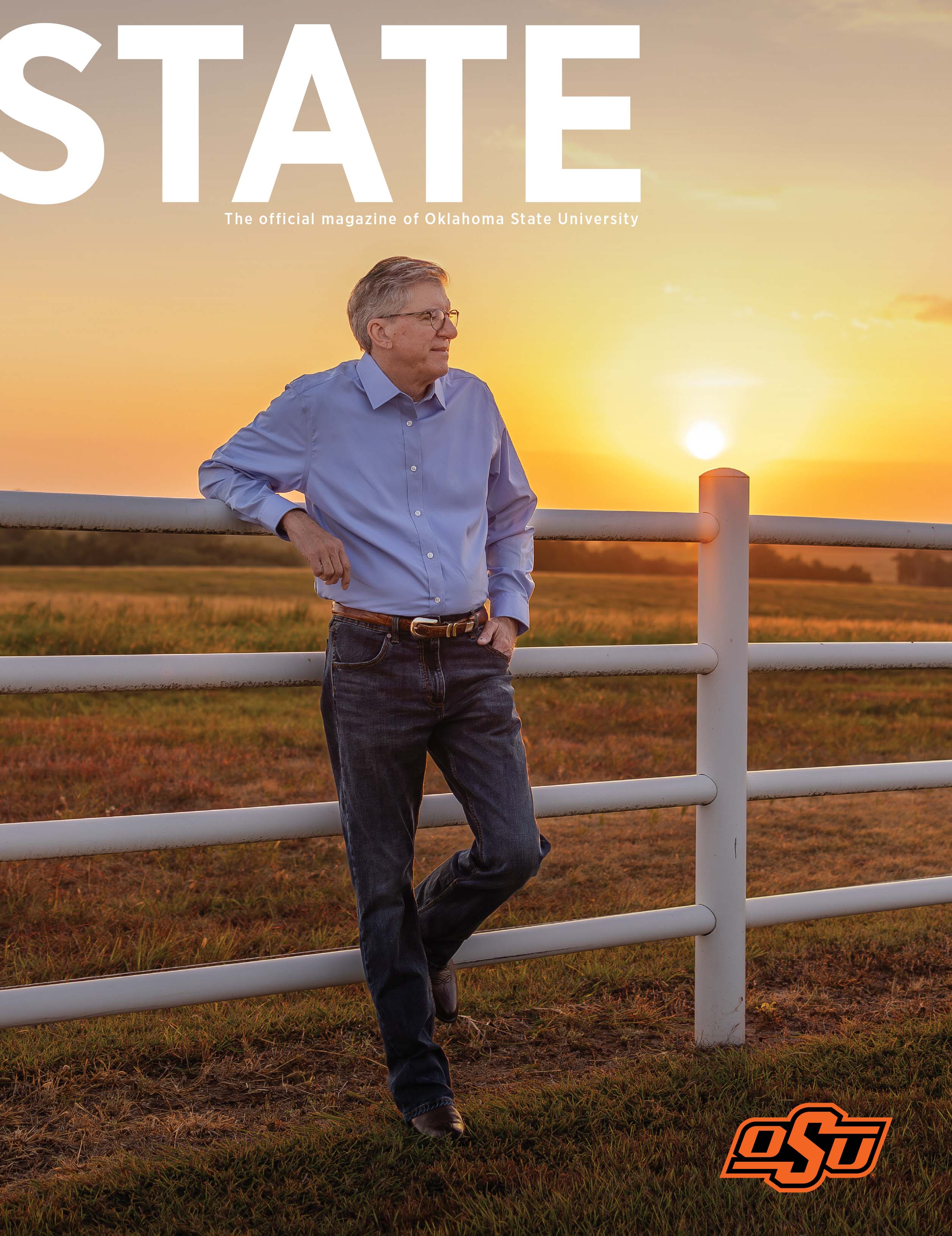 Fall 2025 STATE cover - Jim Hess A person in a blue shirt and jeans leans against a white fence in a field at sunset. The sky glows orange and yellow with the sun near the horizon. The magazine cover reads 'STATE' at the top, with the subtitle 'The official magazine of Oklahoma State University' and the OSU logo in the bottom right corner.