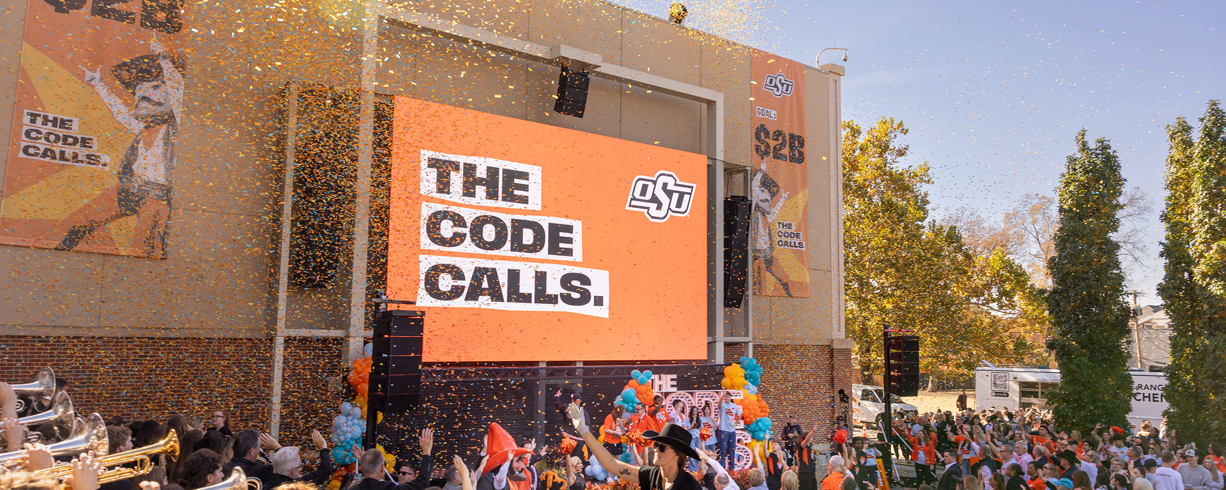 Crowd reacting to confetti drop at The Code Calls launch party on the lawn at the McKnight Center for Performing Arts.